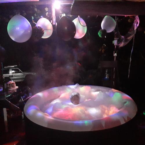 a bath tub with a bunch of balloons in a room at Glamping eco descanso la vega Nocaima in Nocaima