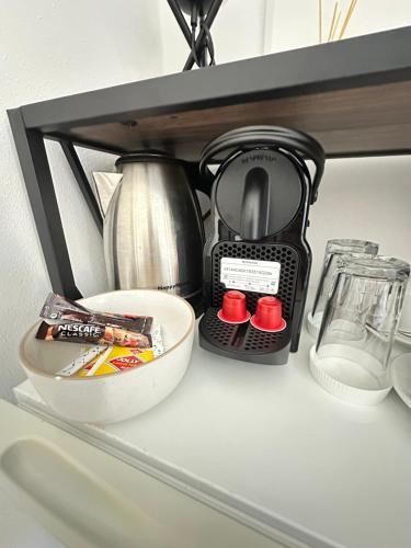 a coffee maker sitting on top of a shelf at Argiro's apartment at Agia Galini in Agia Galini