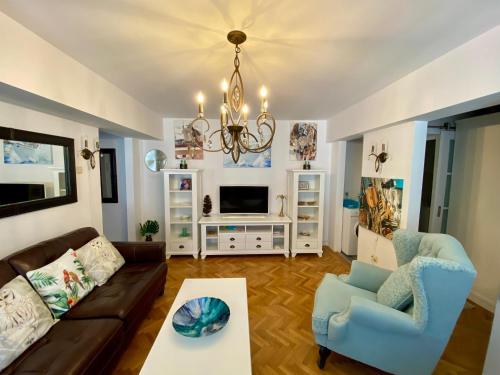a living room with a couch and a table at Old Town Apartment in Constanţa