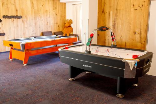 a room with two pool tables in a room at Spreewald Chalet in Burg