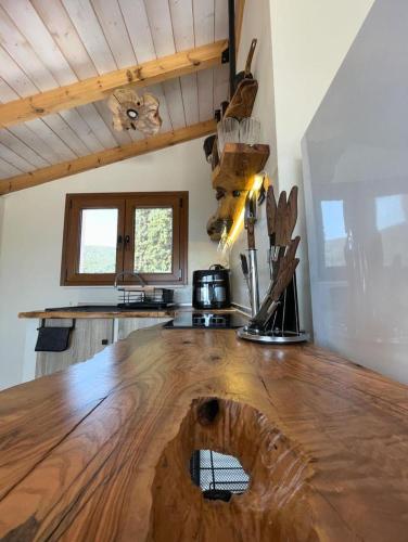 a kitchen with a wooden counter top in a room at Serenity in Samos
