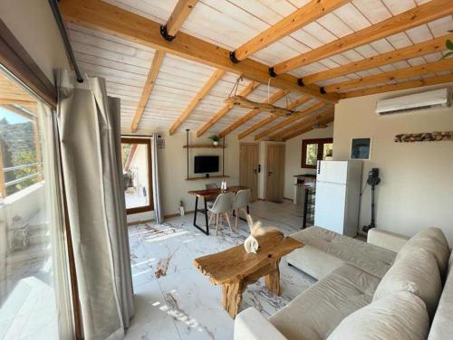 a living room with a couch and a table at Serenity in Samos