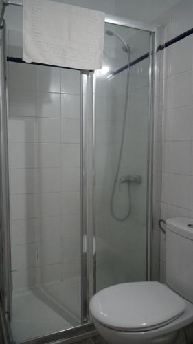 a bathroom with a glass shower with a toilet at Los Padres C in Tijarafe