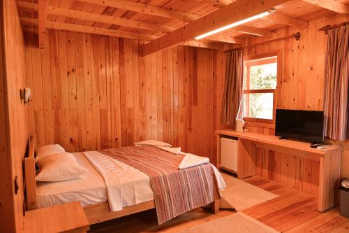 Postel nebo postele na pokoji v ubytování Tolay Hotel