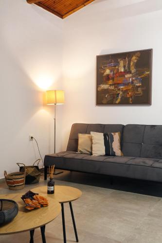 a living room with a couch and a table at ELAION GAIA in Chorto