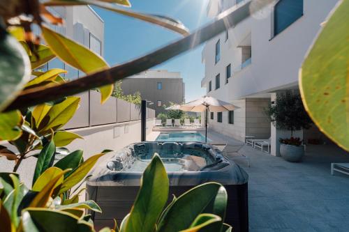 a hot tub on the side of a building at Adria Concept Suites in Zadar