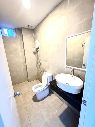 a bathroom with a toilet and a sink at Lotus Homestay in Sihanoukville