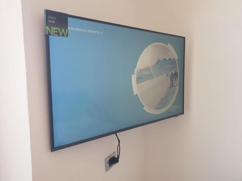 a flat screen tv hanging on a wall at La Perla dell'Adriatico in Termoli