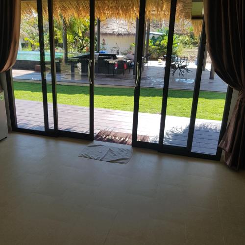 an open door with a view of a patio at Sunrise Beach Resort in Ko Chang