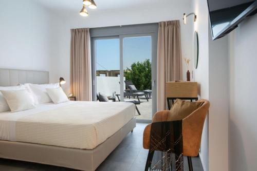 a bedroom with a bed and a balcony at Aloft Luxury Villas Lefkada - Heated pool Lefkia Villa in Apolpaina