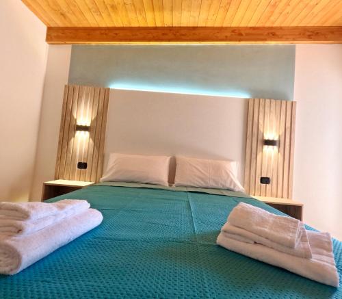 Ένα ή περισσότερα κρεβάτια σε δωμάτιο στο Casa sul Mare