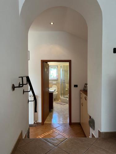 a hallway with a bathroom with a toilet and a sink at Apartment Villa Istriana in Koper