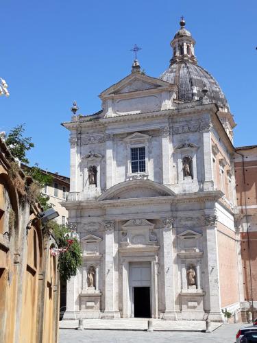 a large stone building with a dome on top at Hotel Minerva in Siena