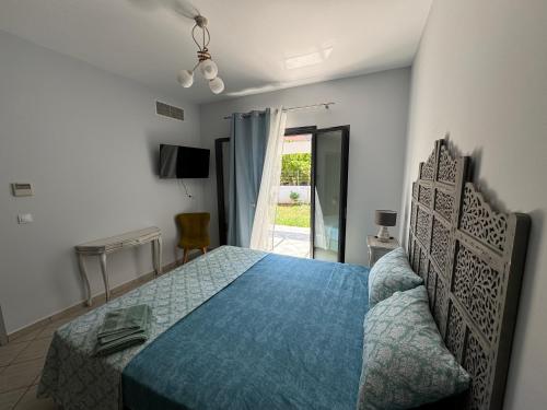 Ένα ή περισσότερα κρεβάτια σε δωμάτιο στο Aetheria Villa Kefalonia