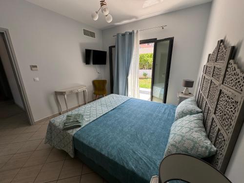 Ένα ή περισσότερα κρεβάτια σε δωμάτιο στο Aetheria Villa Kefalonia
