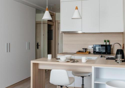 Dapur atau dapur kecil di Оазис-апартаменты у Ботанического сада и EXPO