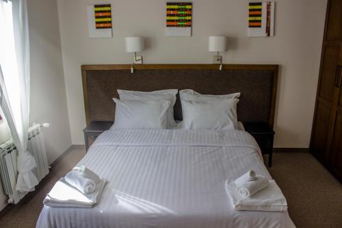 Cama o camas de una habitación en Trigrad Hotel