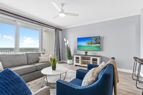 a living room with a couch and chairs at 5-Min to Disney Lakeside Retreat in Orlando