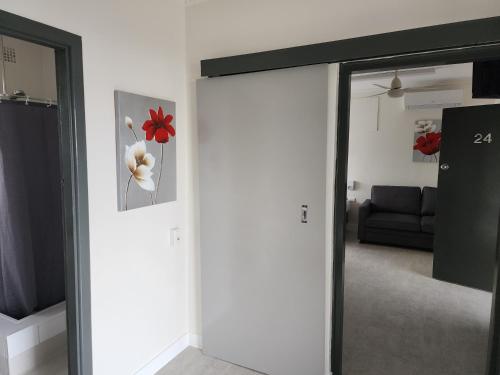 a sliding glass door in a living room with a couch at Inverell Motel in Inverell