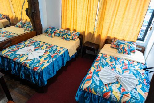 Postel nebo postele na pokoji v ubytování Hotel ARAUCANO