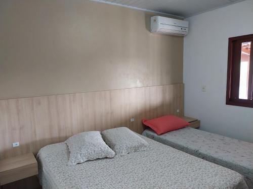 Postel nebo postele na pokoji v ubytování Casa Lagoa e Praia Rosa