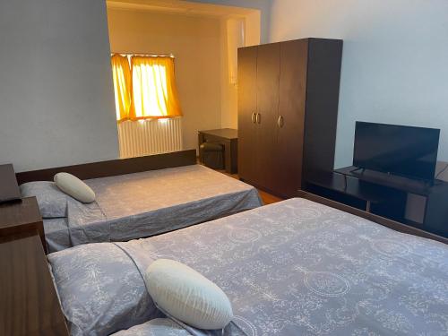 Postel nebo postele na pokoji v ubytování Alpin Guest House