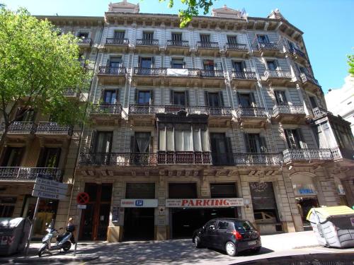 a building with a car parked in front of it at Fashion House in Barcelona