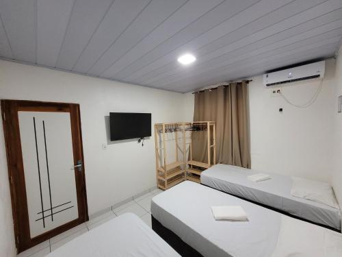 Postel nebo postele na pokoji v ubytování Casa Centro Itacoatiara AM