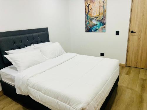 Ένα ή περισσότερα κρεβάτια σε δωμάτιο στο Torre Meraki