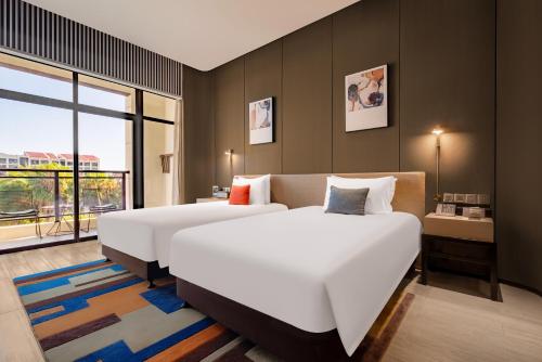 Katil atau katil-katil dalam bilik di Xiamen Lujiang Mingjia Hotel