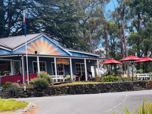 a building with a rainbow painted on the side of it at Romantic Retreat in the Dandenong Mountains in Kalorama
