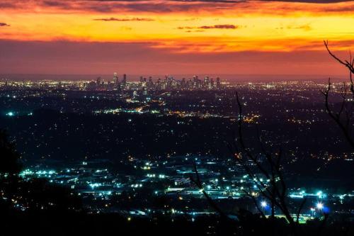 a view of a city at night at Romantic Retreat in the Dandenong Mountains in Kalorama