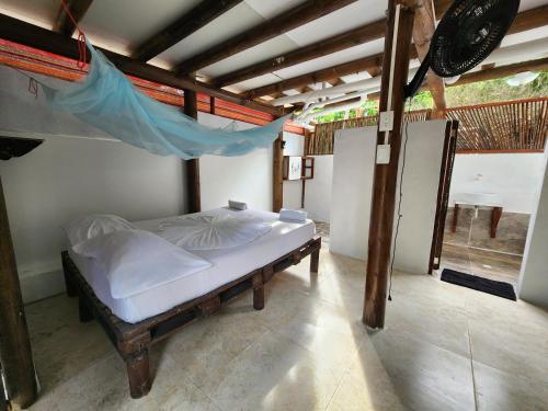 Postel nebo postele na pokoji v ubytování El Hamaquero Hostal EcoNativo