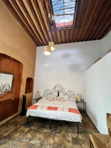 a bedroom with a bed in a room at Hotel Boutique Cantera in Querétaro