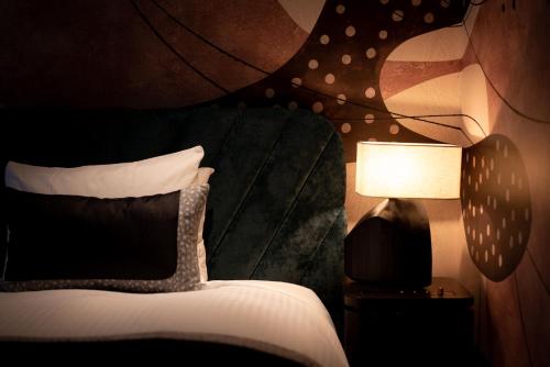 Ένα ή περισσότερα κρεβάτια σε δωμάτιο στο Kirishima Kanko Hotel