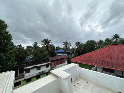 a view from the roof of a building with a red roof at DB Apartment Arimpur in Trichūr