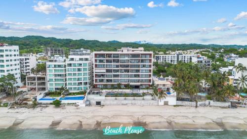 an aerial view of a resort on the beach at Casa del Mar Bucerias - Beachfront Condos in Bucerías