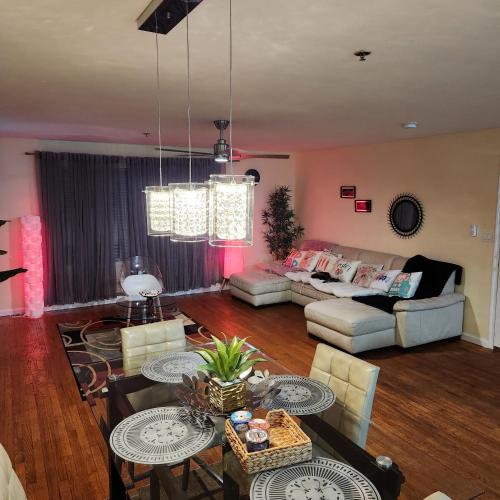 a living room with a couch and a table at Modern Comfort in Newark