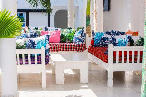 a living room with a couch and a coffee table at Baali Diani Apartments in Ukunda