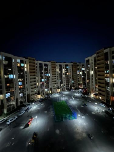 an empty parking lot in a city at night at great apartment in Madrid complex in Kirovo