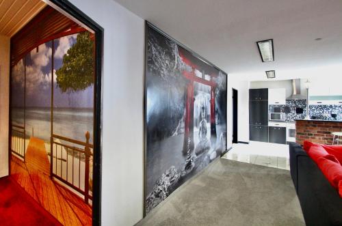 a living room with a large picture on the wall at Suite-Apartment-Essen in Essen