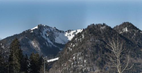 a mountain with snow on the top of it at Ferienwohnung Hochfelln in Ruhpolding
