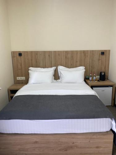 Postel nebo postele na pokoji v ubytování Cone Hotel