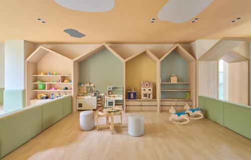 a childs play room with furniture and a ceiling at Hotel Royal Chiao Hsi in Jiaoxi