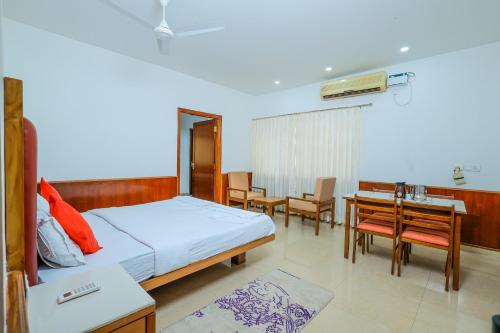 Postel nebo postele na pokoji v ubytování Hotel Janardana