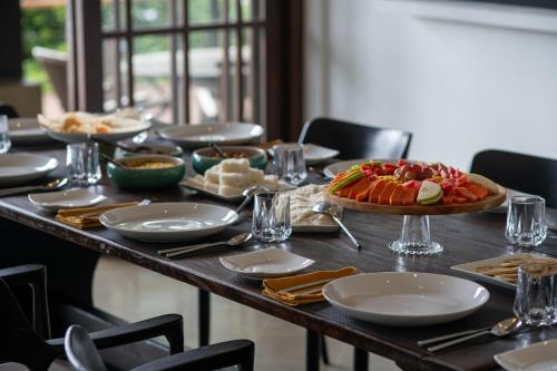 a long table with a table with food on it at Lily Pod in Panadura