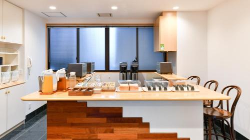 a kitchen with a counter with some food on it at Okazaki Daiichi Hotel East Wing in Okazaki