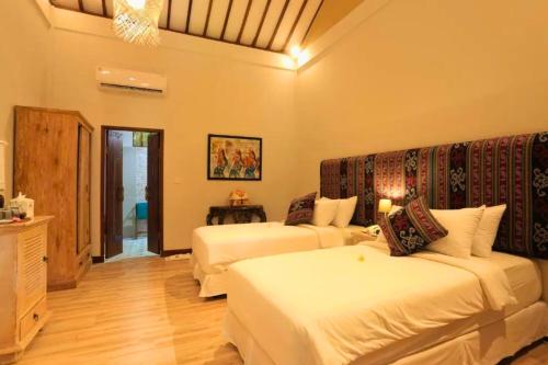 Ένα ή περισσότερα κρεβάτια σε δωμάτιο στο Drisana 1 BR Quirky Garden Room Single ZN136