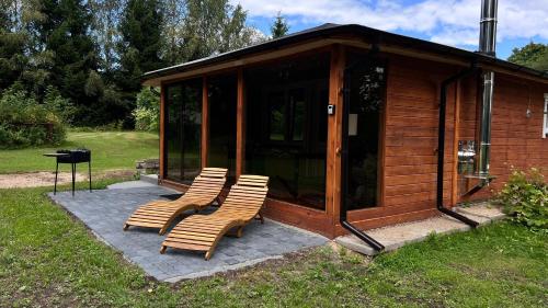 Aed väljaspool majutusasutust Cabin Juodupė