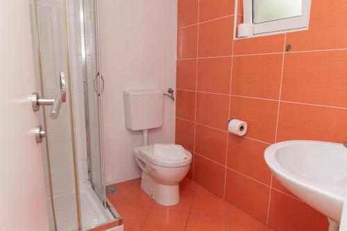 a bathroom with a toilet and a sink at Stara Gavza 155 in Cres